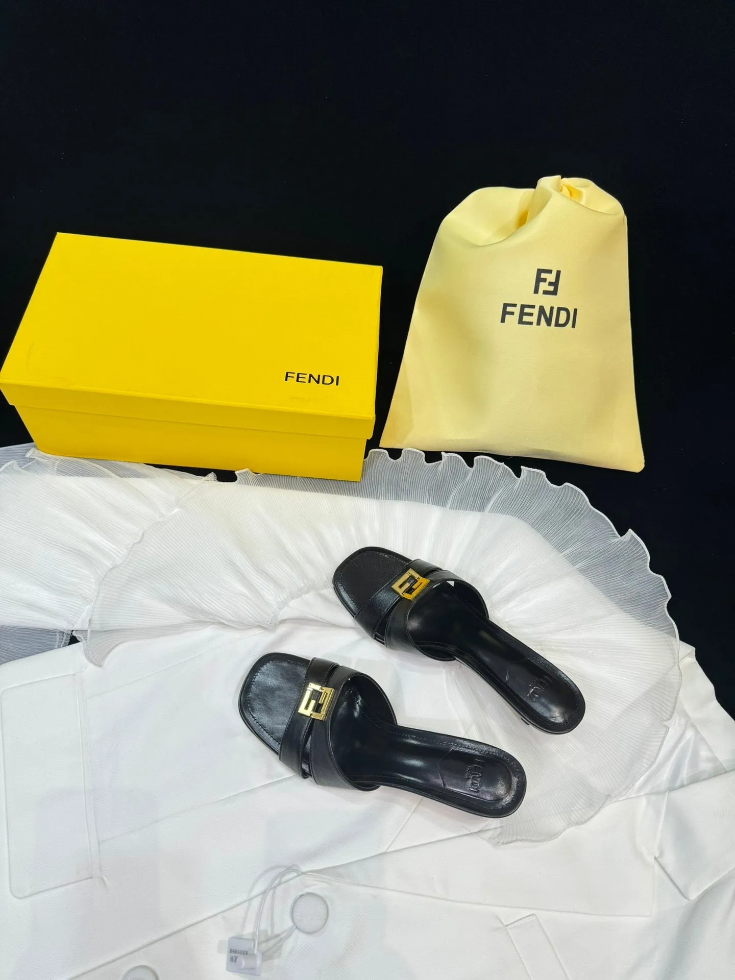 FENDI MEDIUM-HEELED 55 MM MULE IN BLACK LAMBSKIN WITH GOLD HARDWARE